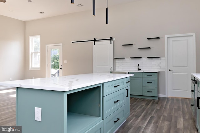 301 Nicholson Rd, Gloucester City, NJ 08030 - kitchen featuring open shelves, dark wood-style floors, decorative backsplash, a barn door, and a kitchen island