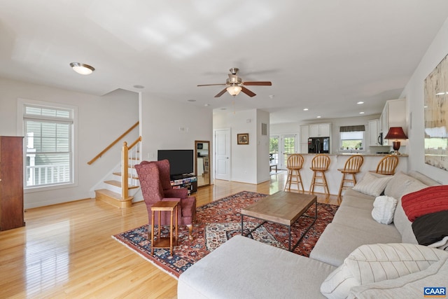 2126 Sundown Pl, Charlottesville, VA 22911 - living room featuring light wood finished floors, ceiling fan, stairs, and recessed lighting