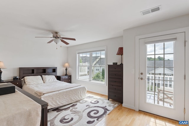 2126 Sundown Pl, Charlottesville, VA 22911 - bedroom with access to exterior, wood finished floors, and a ceiling fan