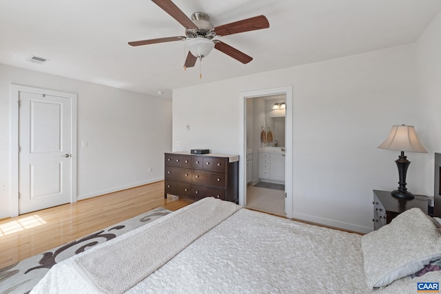 2126 Sundown Pl, Charlottesville, VA 22911 - bedroom with wood finished floors, connected bathroom, and a ceiling fan