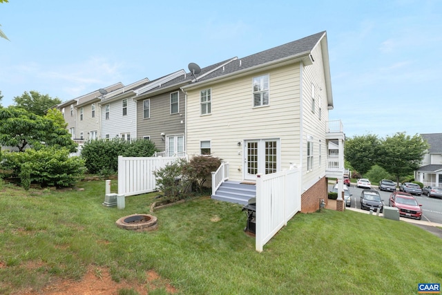 2126 Sundown Pl, Charlottesville, VA 22911 - back of property featuring an outdoor fire pit and a lawn