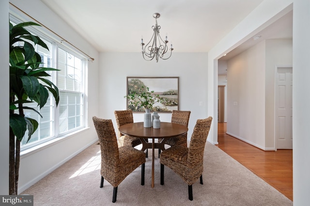 1201 Preserve Ln, Fredericksburg, VA 22401 - dining space with a chandelier, carpet, and wood finished floors