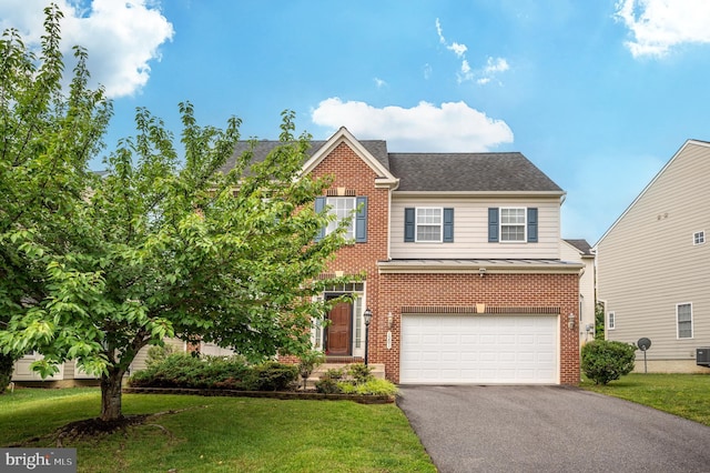 1201 Preserve Ln, Fredericksburg, VA 22401 - view of front facade with brick siding, driveway, a garage, a standing seam roof, and a front yard