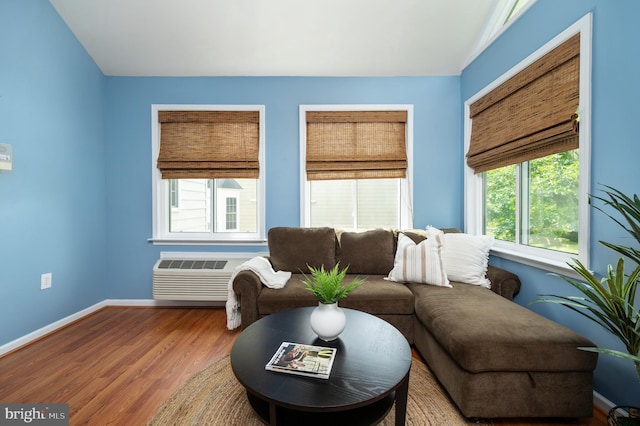 1201 Preserve Ln, Fredericksburg, VA 22401 - living room featuring wood finished floors, a wall mounted air conditioner, and vaulted ceiling