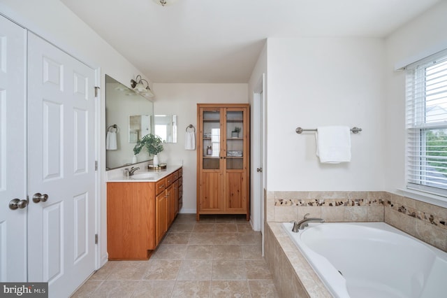 1201 Preserve Ln, Fredericksburg, VA 22401 - bathroom featuring vanity, a garden tub, plenty of natural light, and tile patterned flooring