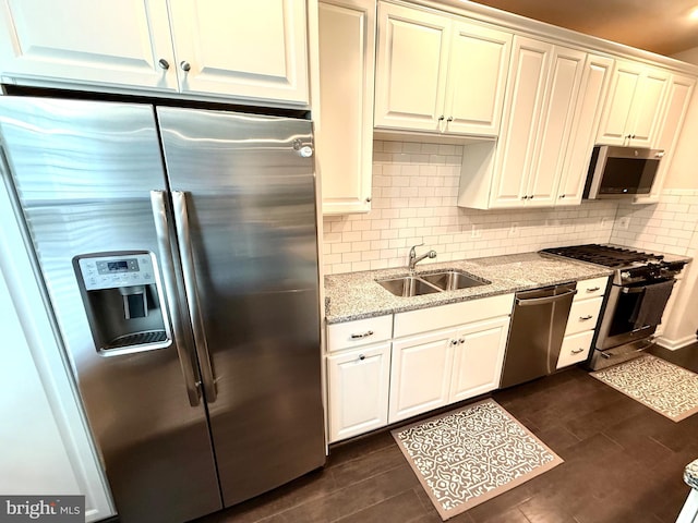 23245 Milltown Knoll Sq Unit 103, Ashburn, VA 20148 - kitchen featuring appliances with stainless steel finishes, light stone counters, backsplash, and dark wood finished floors