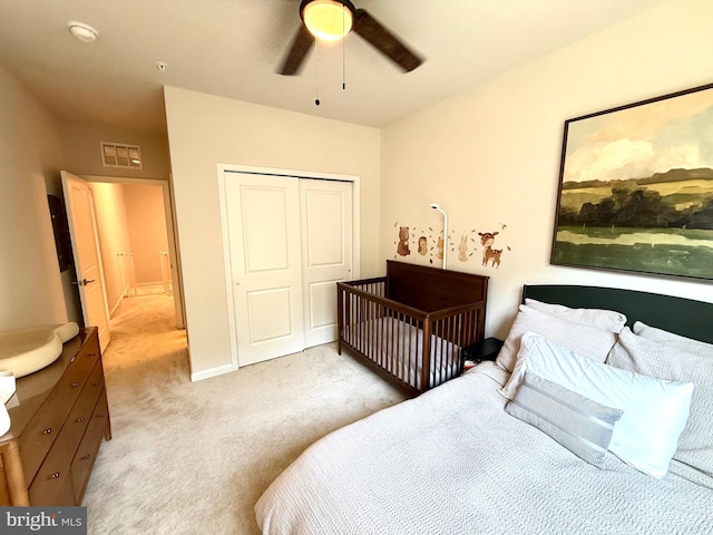 23245 Milltown Knoll Sq Unit 103, Ashburn, VA 20148 - bedroom with a closet, light carpet, and a ceiling fan