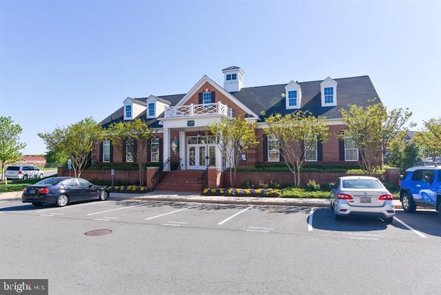 23245 Milltown Knoll Sq Unit 103, Ashburn, VA 20148 - view of building exterior with uncovered parking
