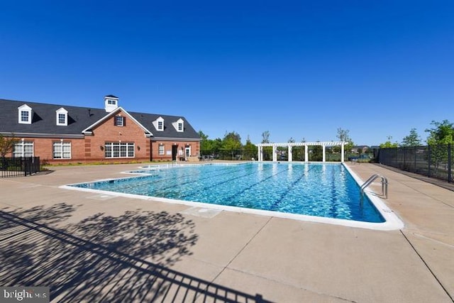 23245 Milltown Knoll Sq Unit 103, Ashburn, VA 20148 - community pool featuring a patio area