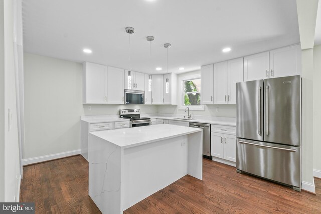 7724 Central Ave, Pasadena, MD 21122 - kitchen with appliances with stainless steel finishes, light countertops, white cabinets, recessed lighting, and a kitchen island