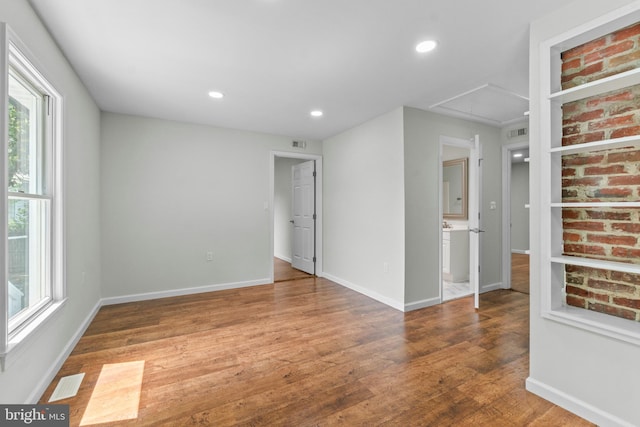 7724 Central Ave, Pasadena, MD 21122 - spare room with attic access, plenty of natural light, wood finished floors, and recessed lighting