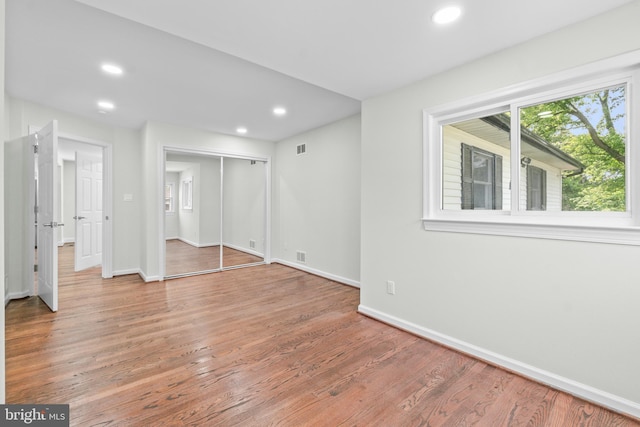 7724 Central Ave, Pasadena, MD 21122 - unfurnished bedroom with recessed lighting, wood finished floors, and a closet