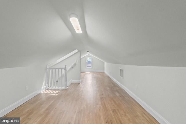 7724 Central Ave, Pasadena, MD 21122 - additional living space with lofted ceiling and light wood-style floors