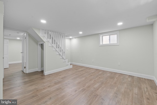 7724 Central Ave, Pasadena, MD 21122 - below grade area featuring light wood-style floors, stairs, and recessed lighting