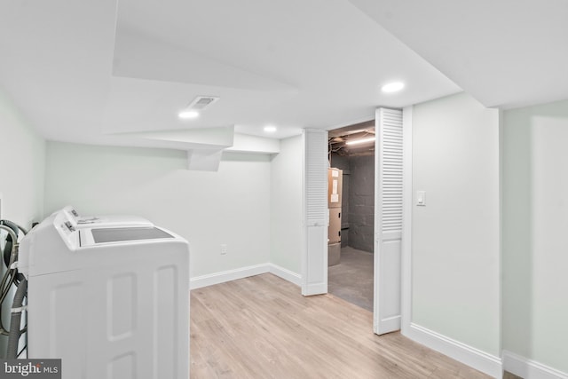 7724 Central Ave, Pasadena, MD 21122 - laundry area with washer and clothes dryer, light wood-style floors, and recessed lighting