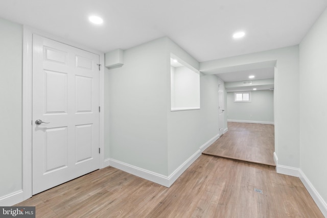 7724 Central Ave, Pasadena, MD 21122 - below grade area with light wood-style flooring and recessed lighting
