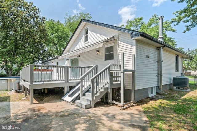 7724 Central Ave, Pasadena, MD 21122 - back of house with a wooden deck and an outdoor pool
