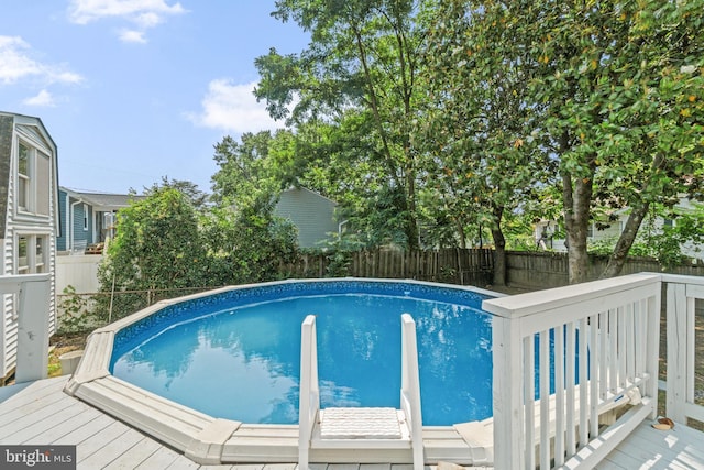 7724 Central Ave, Pasadena, MD 21122 - view of pool with a wooden deck and a fenced backyard