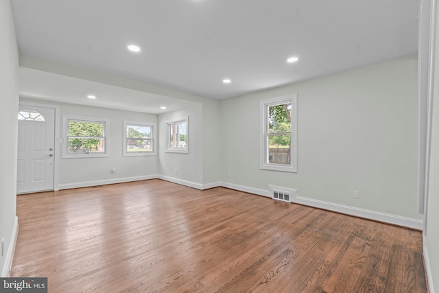 7724 Central Ave, Pasadena, MD 21122 - empty room featuring plenty of natural light, wood finished floors, and recessed lighting