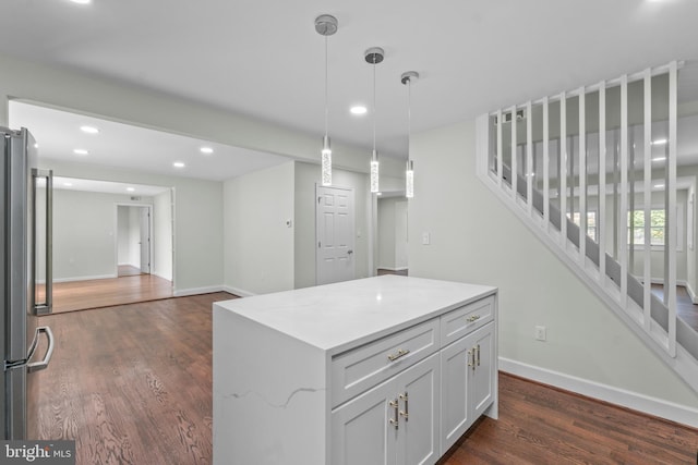 7724 Central Ave, Pasadena, MD 21122 - kitchen featuring dark wood finished floors, recessed lighting, decorative light fixtures, a center island, and white cabinetry
