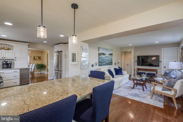 620 Laurel Rd, Springfield, PA 19064 - kitchen featuring open floor plan, appliances with stainless steel finishes, dark wood-style floors, white cabinets, and recessed lighting