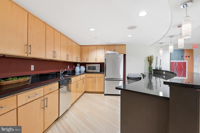 915 E St NW Unit 1103, Washington, DC 20004 - kitchen featuring appliances with stainless steel finishes, light brown cabinets, dark countertops, light wood-type flooring, and recessed lighting