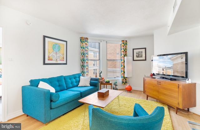 915 E St NW Unit 1103, Washington, DC 20004 - living room featuring wood finished floors and baseboards