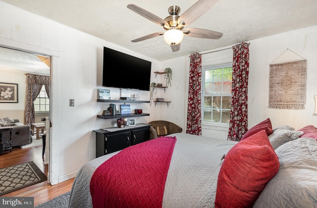 1815 Belle Ave, Dundalk, MD 21222 - bedroom with wood finished floors, multiple windows, and a ceiling fan