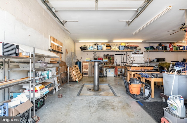 1815 Belle Ave, Dundalk, MD 21222 - garage featuring a workshop area and concrete block wall