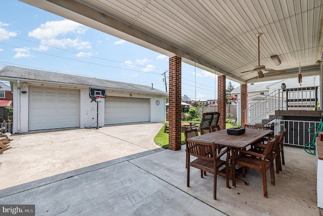 1815 Belle Ave, Dundalk, MD 21222 - view of patio / terrace featuring a garage, outdoor dining space, and stairway