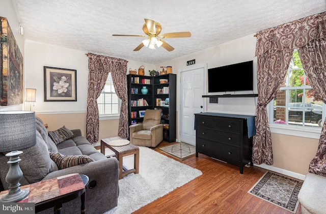 1815 Belle Ave, Dundalk, MD 21222 - living area featuring a ceiling fan, a textured ceiling, and wood finished floors