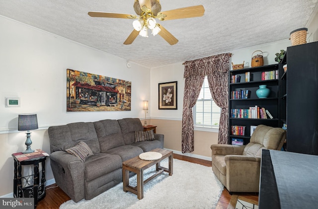 1815 Belle Ave, Dundalk, MD 21222 - living area featuring a textured ceiling, ceiling fan, wood finished floors, and ornamental molding