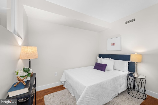 1390 Kenyon St NW Unit 524, Washington, DC 20010 - bedroom with wood finished floors and baseboards