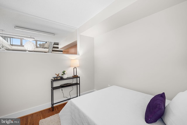 1390 Kenyon St NW Unit 524, Washington, DC 20010 - bedroom with wood finished floors and baseboards