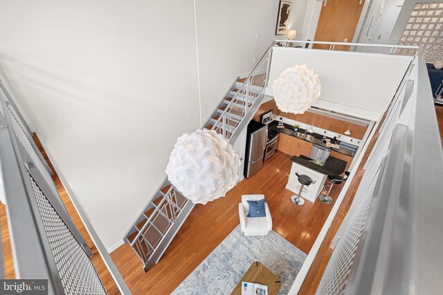1390 Kenyon St NW Unit 524, Washington, DC 20010 - staircase with wood finished floors