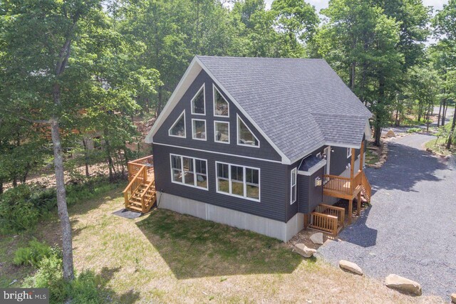 130 Wisp Adventure Rd, Mc Henry, MD 21541 - view of property exterior with stairs, a deck, roof with shingles, and view of wooded area