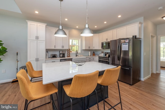 130 Wisp Adventure Rd, Mc Henry, MD 21541 - kitchen with appliances with stainless steel finishes, light countertops, white cabinets, light wood-style floors, and recessed lighting