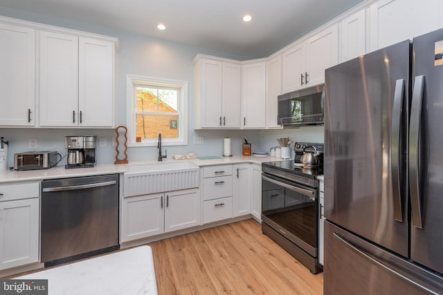130 Wisp Adventure Rd, Mc Henry, MD 21541 - kitchen with appliances with stainless steel finishes, light wood-style floors, light countertops, white cabinets, and recessed lighting