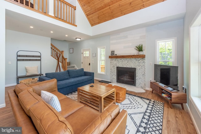 130 Wisp Adventure Rd, Mc Henry, MD 21541 - living room featuring wood finished floors, stairway, a fireplace, recessed lighting, and high vaulted ceiling