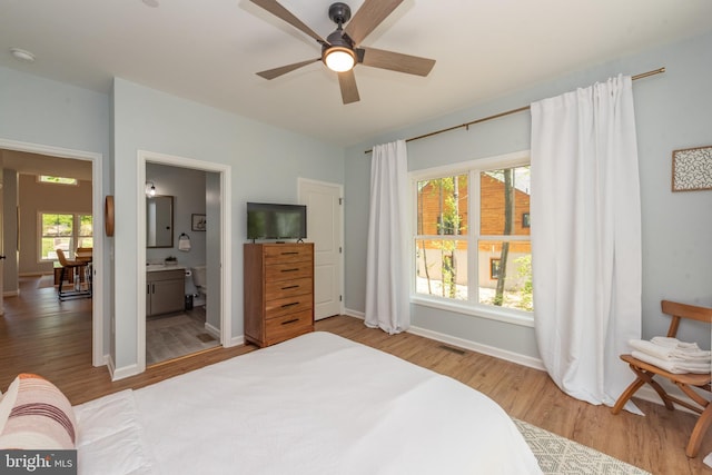 130 Wisp Adventure Rd, Mc Henry, MD 21541 - bedroom with wood finished floors, multiple windows, and ensuite bathroom