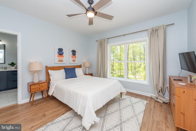 130 Wisp Adventure Rd, Mc Henry, MD 21541 - bedroom with light wood-style floors, ensuite bath, and ceiling fan