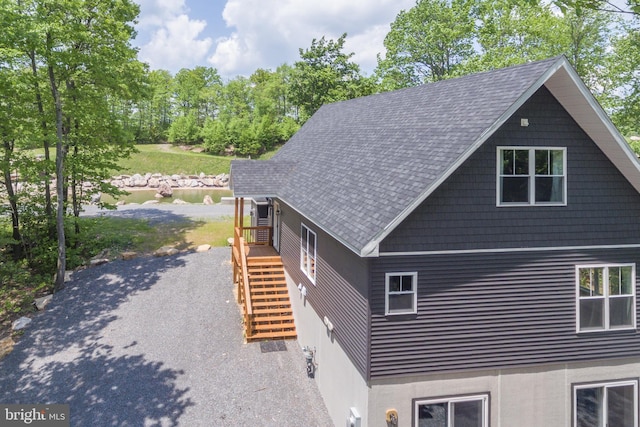 130 Wisp Adventure Rd, Mc Henry, MD 21541 - view of home's exterior featuring stairway, a shingled roof, and stucco siding