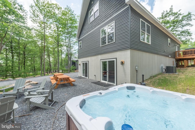 130 Wisp Adventure Rd, Mc Henry, MD 21541 - rear view of property featuring a hot tub, a wooden deck, and stucco siding