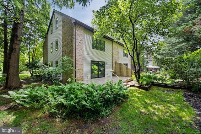 201 Steeplechase Cir, Wilmington, DE 19808 - rear view of house with a patio and brick siding