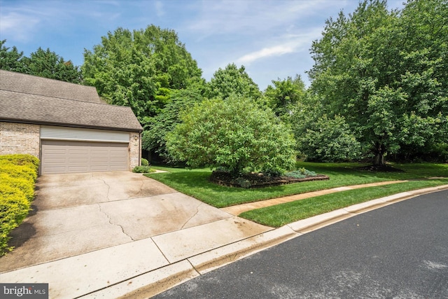 201 Steeplechase Cir, Wilmington, DE 19808 - view of front of property with brick siding, a front yard, a garage, and concrete driveway