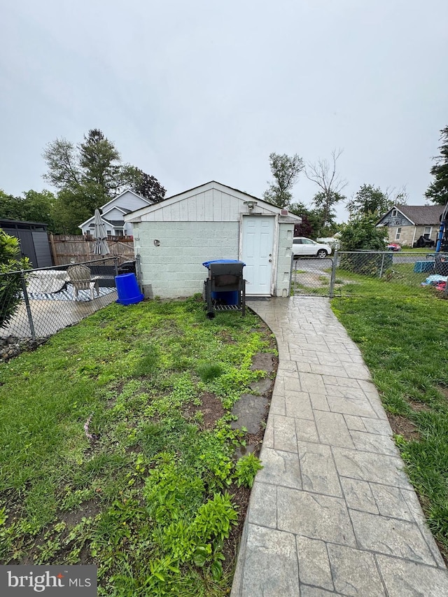 10 Chestnut St, Lumberton, NJ 08048 - view of side of property featuring a gate, an outbuilding, and concrete block siding