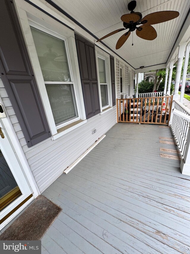 10 Chestnut St, Lumberton, NJ 08048 - wooden porch with a ceiling fan
