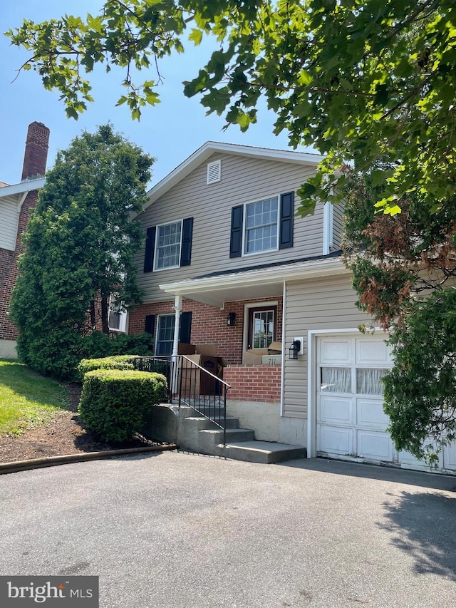 711 E Cork St, Winchester, VA 22601 - view of front of house featuring brick siding