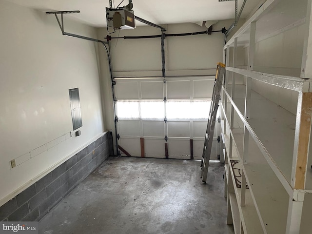 711 E Cork St, Winchester, VA 22601 - garage with a garage door opener and concrete block wall