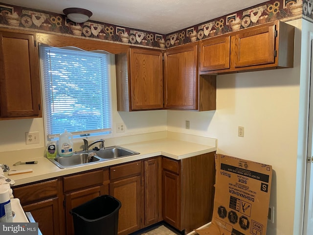 711 E Cork St, Winchester, VA 22601 - kitchen with light countertops and brown cabinetry